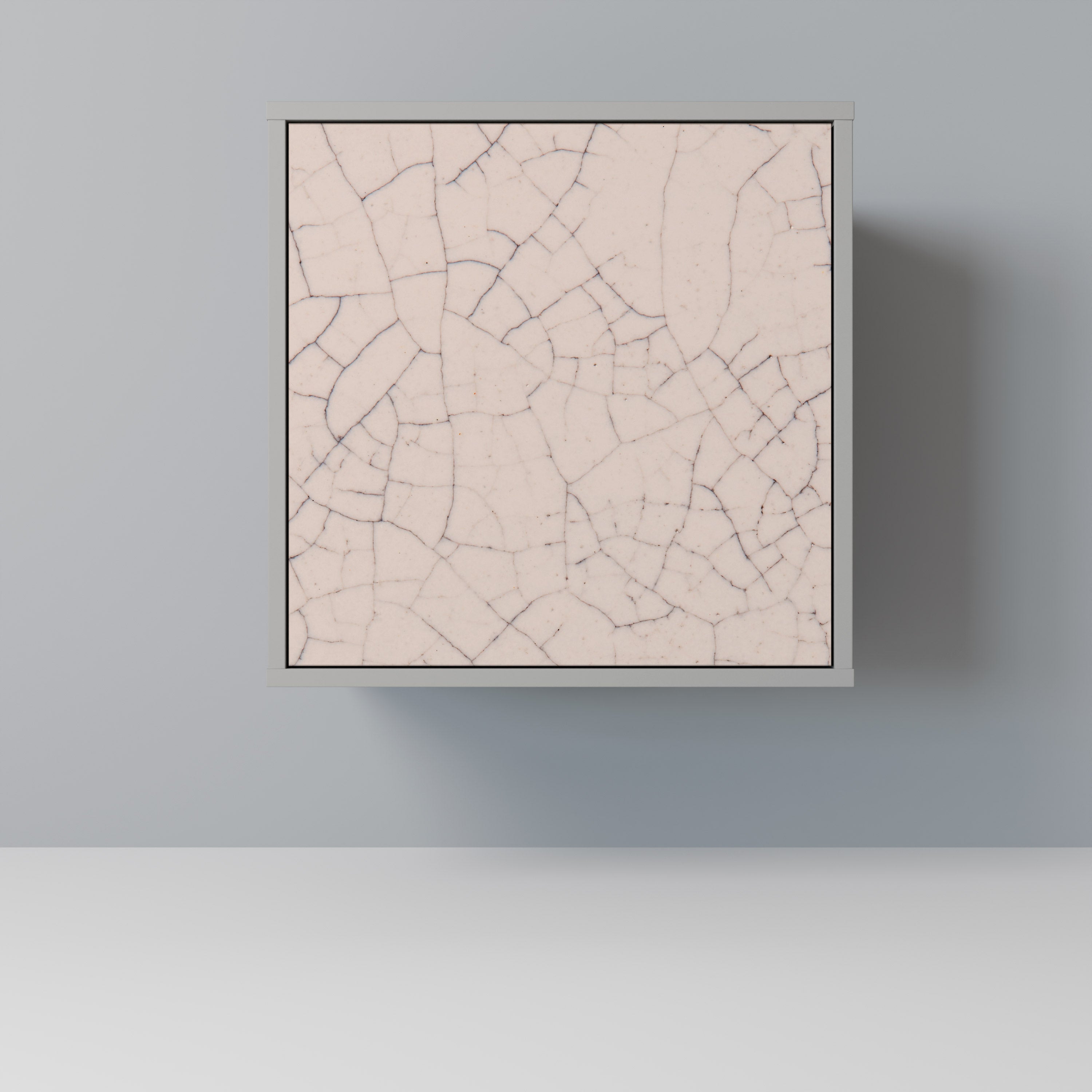 Aparador de 1 puerta con textura cerámica y acabado gris.