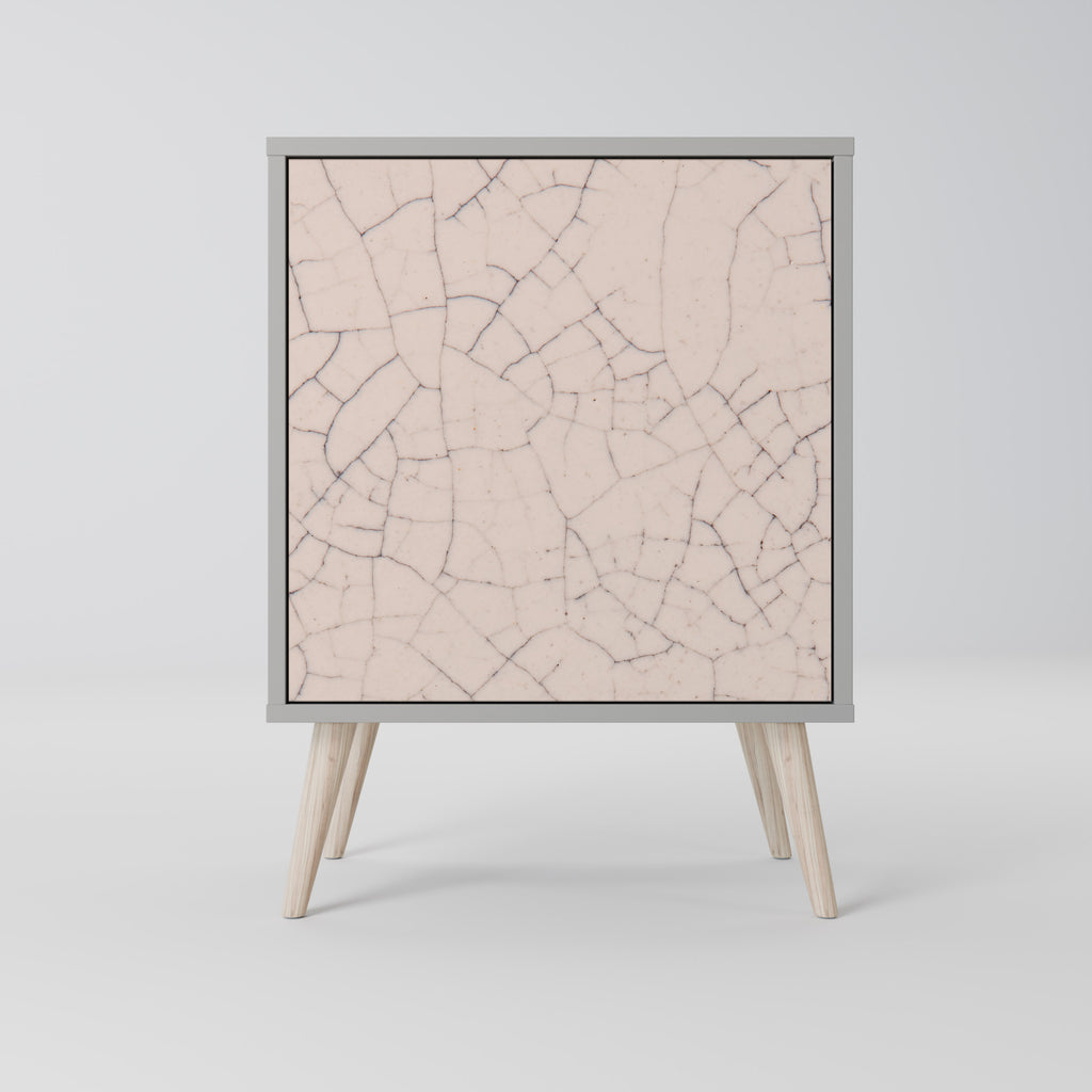 Aparador de 1 puerta con textura cerámica y acabado gris.