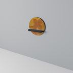 STRENGTHENING RELATION Round Art Shelf In Black Finish
